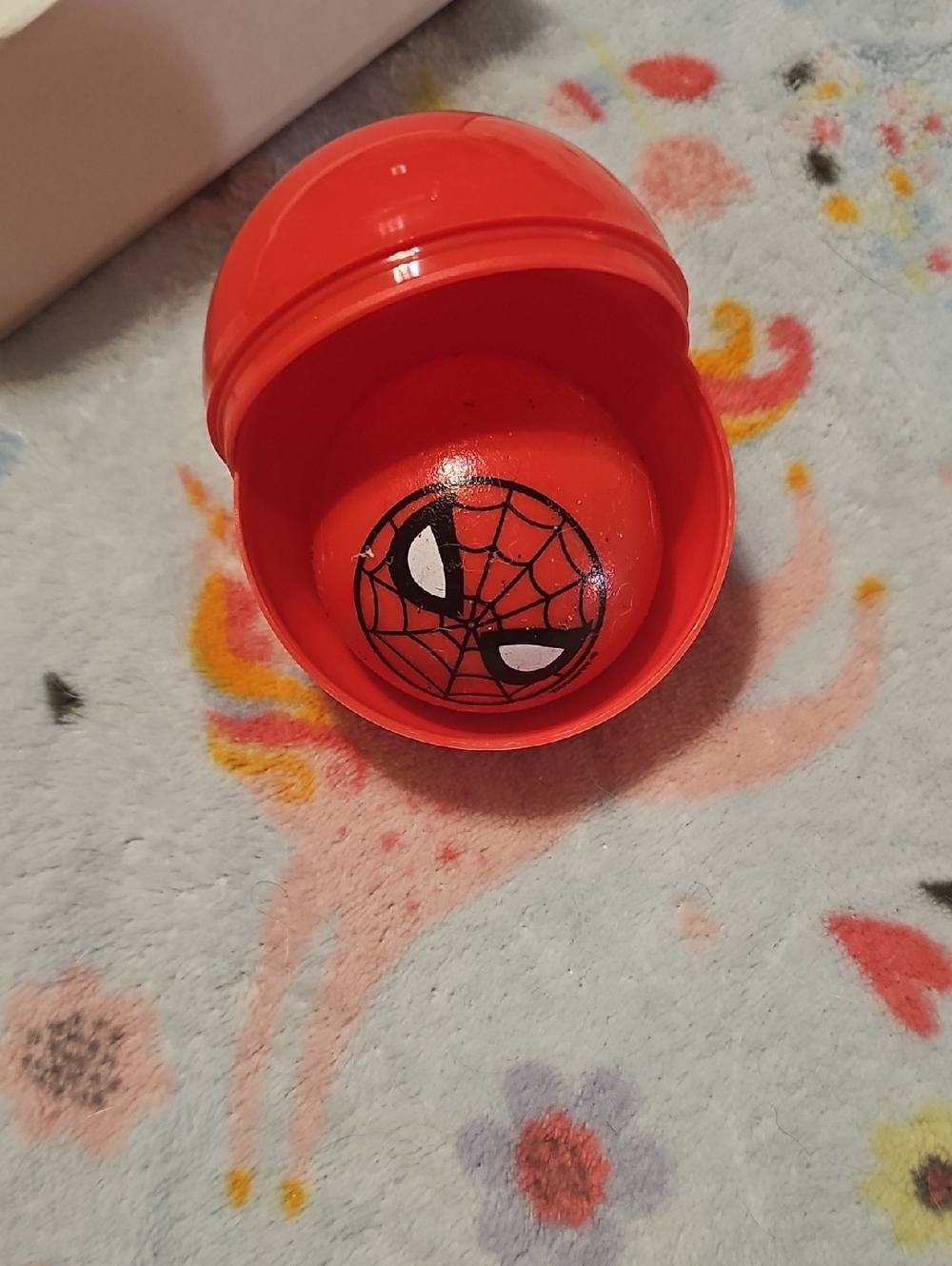 Spiderman Red Surprise Capsule with Spider-Web Face Squishy Ball